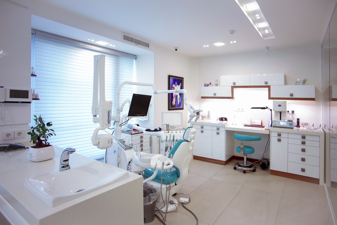 BrightSmile Dental's bright, calm treatment room with a comfortable teal patient chair