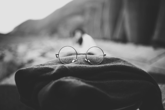 Lunet Pell thin round wire frames resting on folded wool
