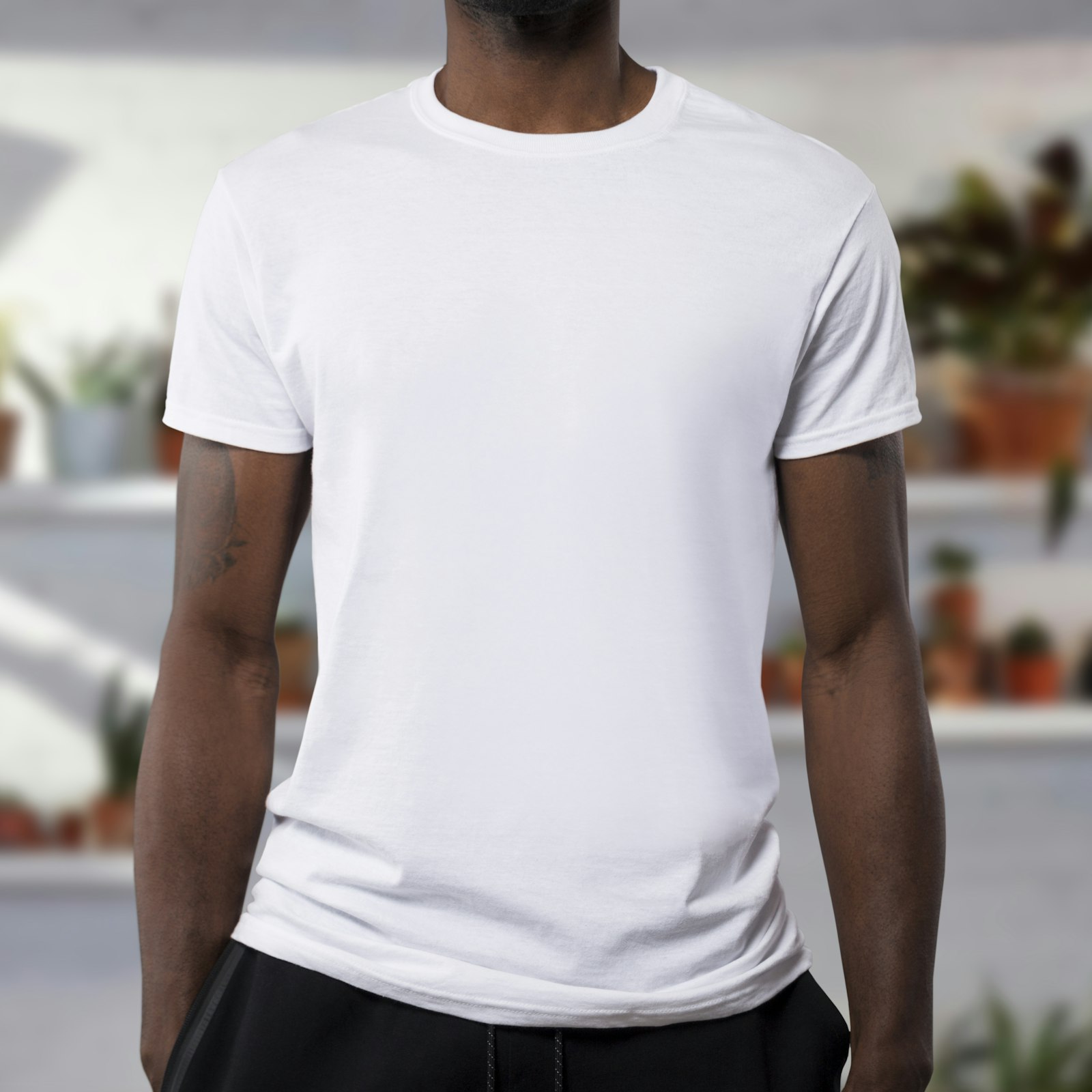 Plain white heavyweight tee worn by a model, cropped at the shoulders
