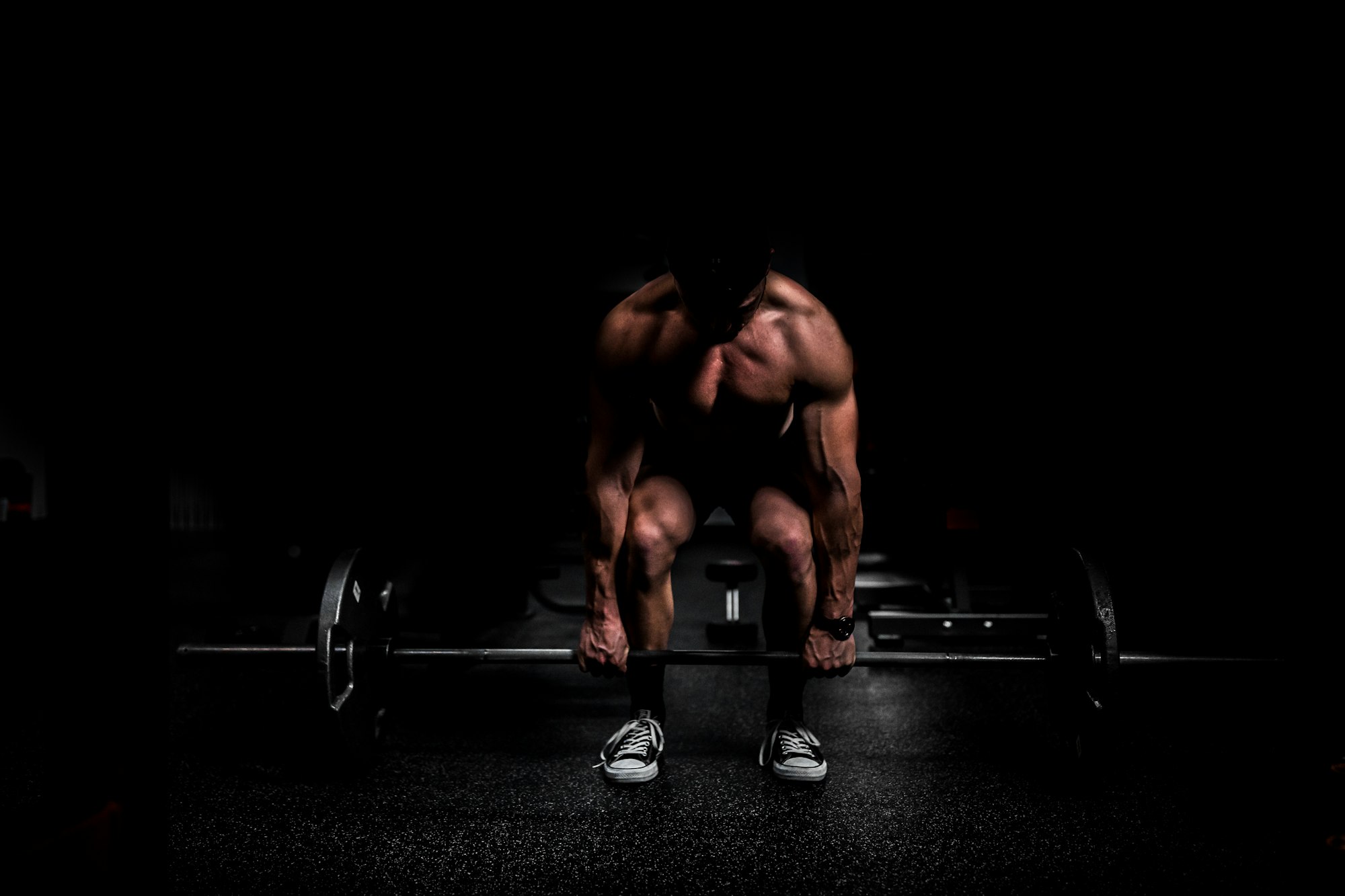 Athlete setting up for a heavy deadlift on a lifting platform