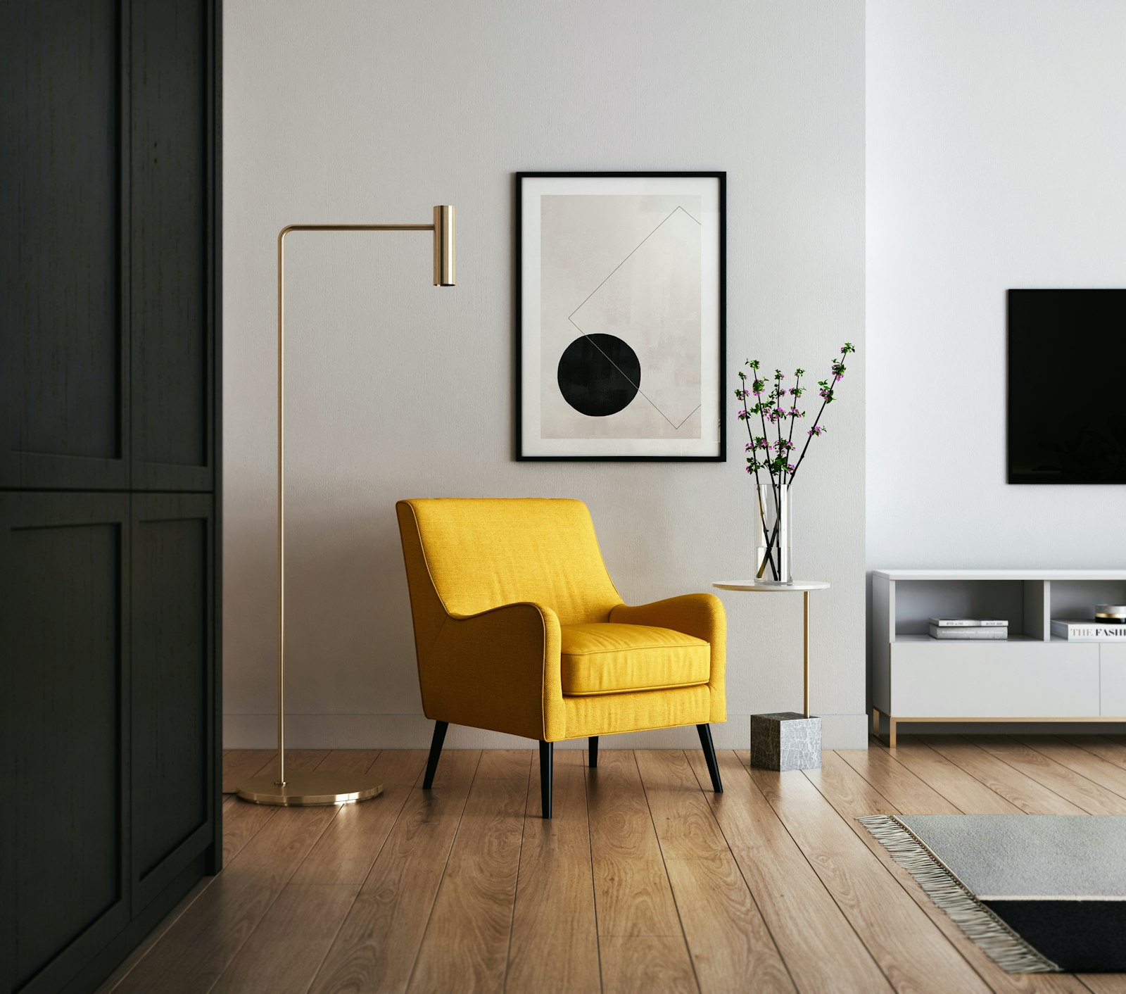 Mustard-yellow upholstered armchair beside a slim brass floor lamp on oak flooring