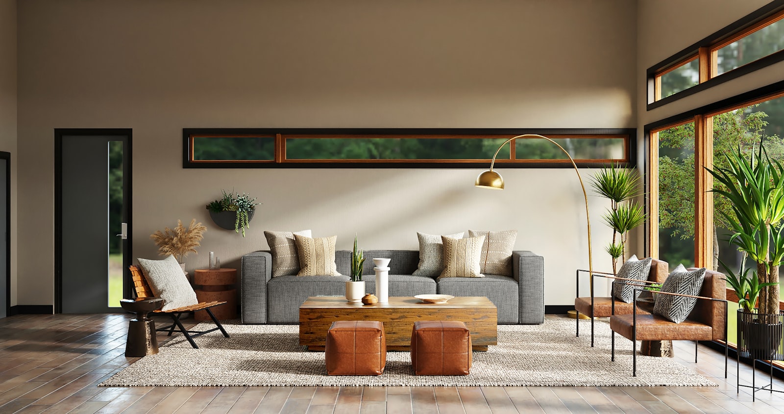 Warm modern living room: a grey modular sofa with woven cushions, a chunky wooden coffee table, two tan leather ottomans, a brass arc floor lamp, a jute rug and a leather sling chair by the window