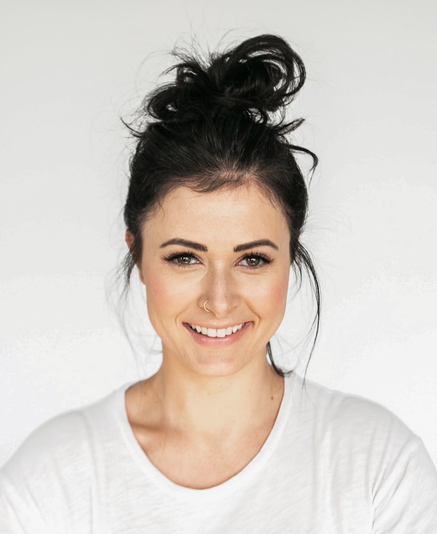 Marguerite Hale, founder of Baseline Rehab and Performance, smiling in a plain white t-shirt.