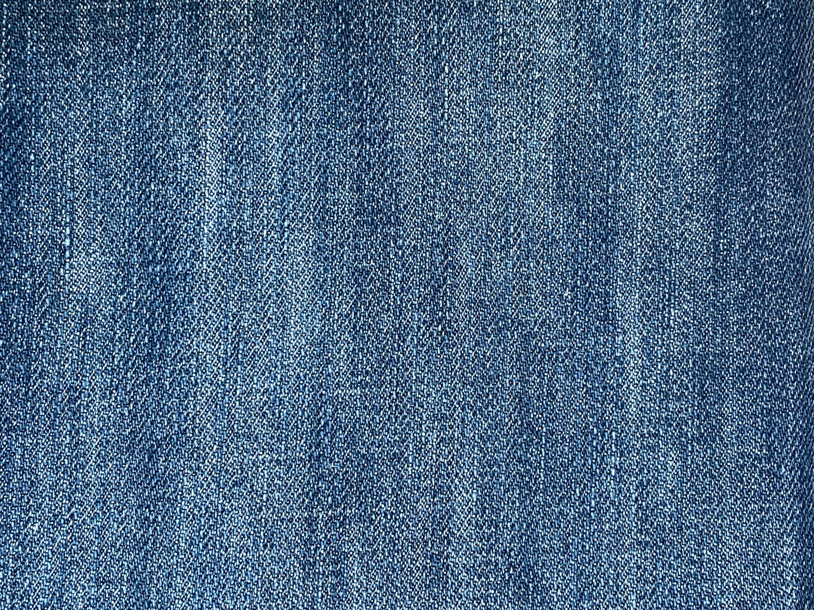 Cận cảnh mặt vải denim xanh chéo go với sợi bông thô