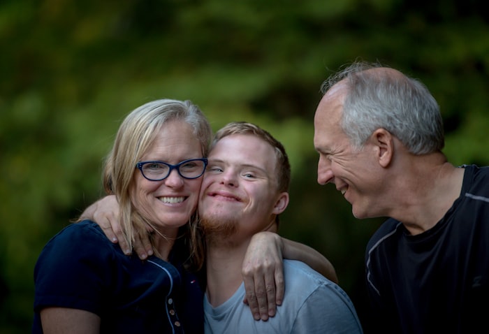 Three members of a family across two generations standing together outdoors